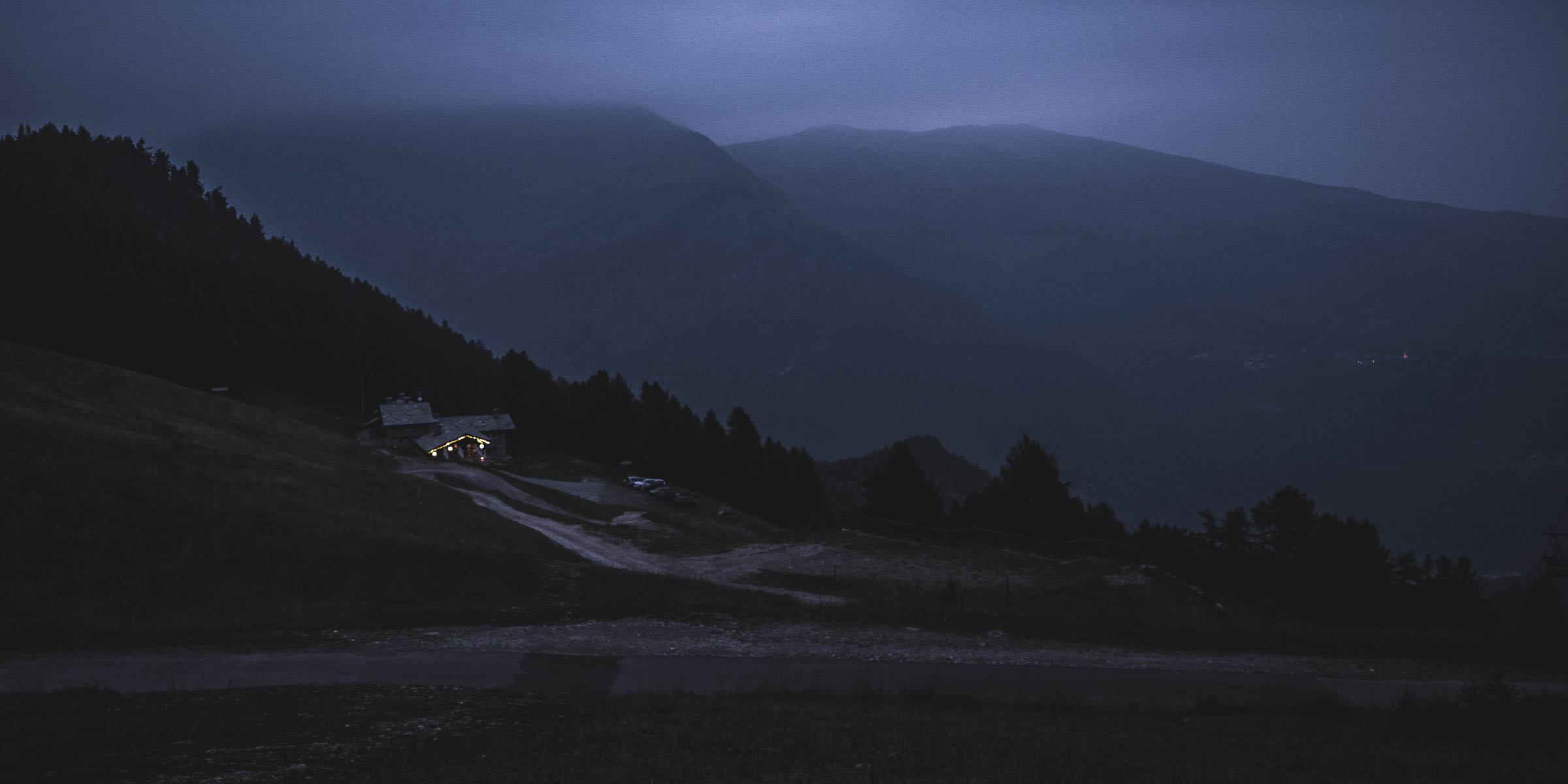 Looking down from Colle di Sampeyre after sunset with a refugio in sight